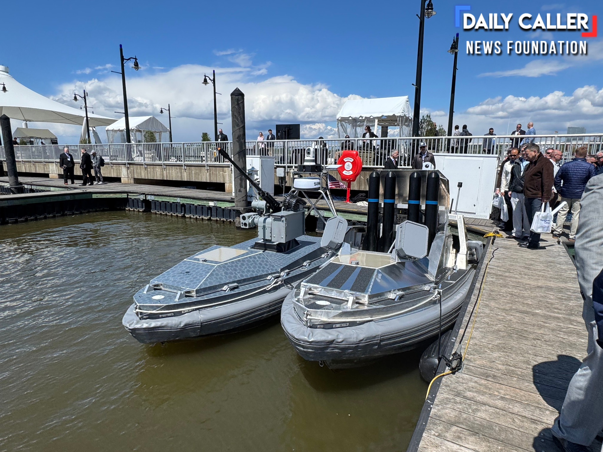 BlackSea Technologies' Chaser USVs with a 30mm autocannon and dummy missiles docked at the Air Space Sea 2026 expo. (Francis Kapper / Daily Caller News Foundation)